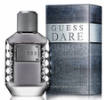 Guess Dare Eau de Toilette bottle and packaging box. The bottle is a faceted metallic silver-gray glass with a textured cap, and the box features a blue-gray textured pattern with a silver band displaying the 'GUESS DARE' logo.