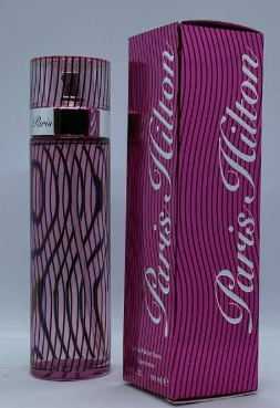 A Paris Hilton perfume bottle with a pink and black wavy pattern next to its matching pink packaging box, featuring the Paris Hilton logo.