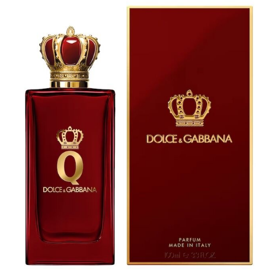 Dolce & Gabbana Q Parfum bottle in deep red glass with a gold crown cap, shown next to its matching red and gold outer box on a white background.