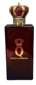 Dolce & Gabbana Q Eau de Parfum bottle in a deep burgundy glass with a gold and red crown cap, shown against a plain white background.