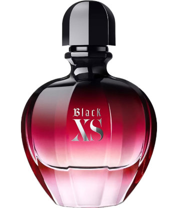 A bottle of Black XS perfume with a faceted glass body showing a gradient from deep red to pink, topped with a glossy black cap. The text 'Black XS' is printed on the front.