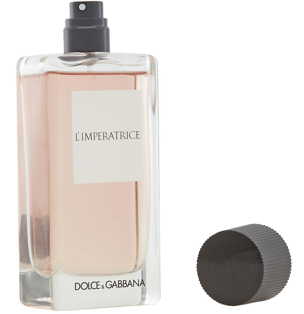 Dolce & Gabbana L'Imperatrice Eau de Toilette perfume bottle filled with pale pink liquid, shown with its black spray nozzle removed and placed beside it on a white background.