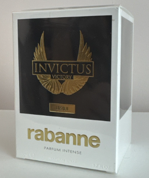 A white rectangular box for Rabanne Absolu Parfum Intense, featuring a large black front panel with a gold winged logo and the text 'INVICTUS VICTORY' and 'ABSOLU'.
