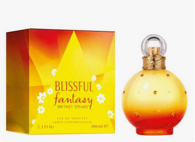 Britney Spears Blissful Fantasy Eau de Toilette perfume bottle and its packaging box. The bottle is a round, translucent yellow-to-orange gradient glass with small gold rhinestone accents and a gold cap.