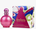 Britney Spears 'Fantasy' Eau de Parfum bottle and packaging box. The bottle is a glossy, rounded magenta pink with a textured glittery neck and small rhinestone accents.