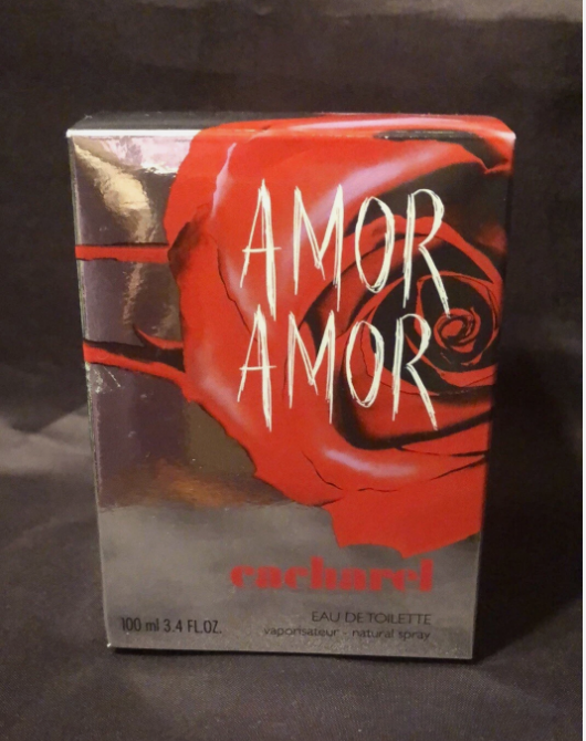 Richard Amor Amor Eau De Toilette perfume box, featuring a bold red rose design with white stylized text on a dark background.