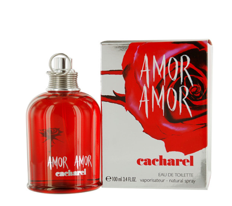 A bottle of Cacharel Amor Amor Eau de Toilette next to its retail box, featuring a vibrant red glass bottle and a box decorated with a large red rose on a silver background.
