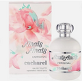 A bottle of Cacharel Amais Amais L'Original Eau de Toilette next to its matching floral box. The packaging features a watercolor pink flower design with mint green accents, and the bottle is frosted white with a silver cap and label.