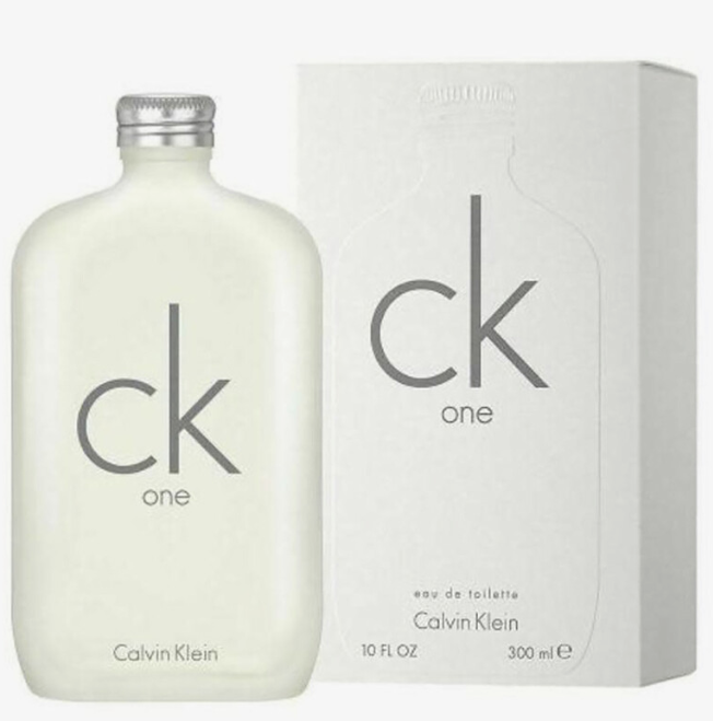 Calvin Klein CK One Eau de Toilette bottle in frosted off-white glass with a silver cap, shown next to its white packaging box. The bottle and box feature the gray 'ck one' logo and Calvin Klein branding.