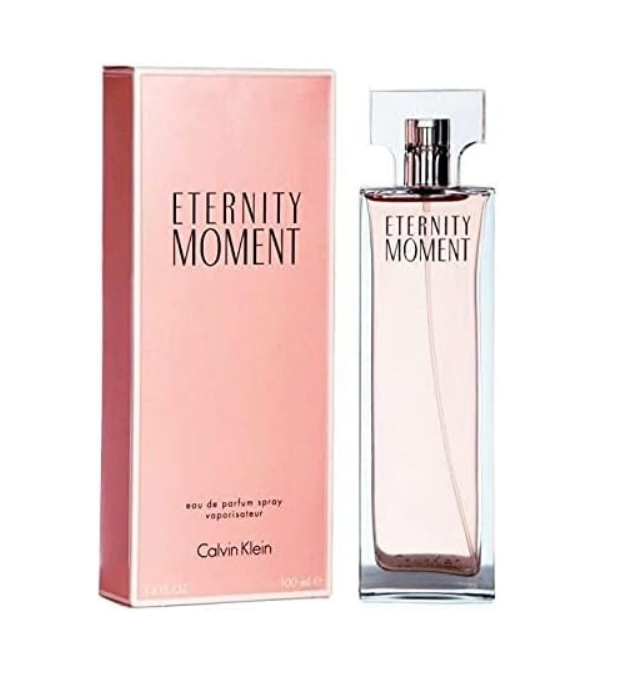 Calvin Klein Eternity Moment Eau de Parfum spray bottle next to its pink packaging box, on a plain white background.