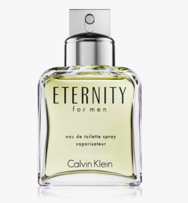 Calvin Klein Eternity for men eau de toilette spray in a clear glass bottle with a silver spray cap, filled with pale yellow-green liquid, on a light gray background.