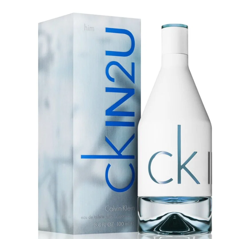 Calvin Klein Him IN2U Eau de Toilette bottle and packaging box. The bottle is white with a blue cap and features the 'ck in2u' text in blue, while the box has a light blue marble pattern with the brand name 'CK' in blue.