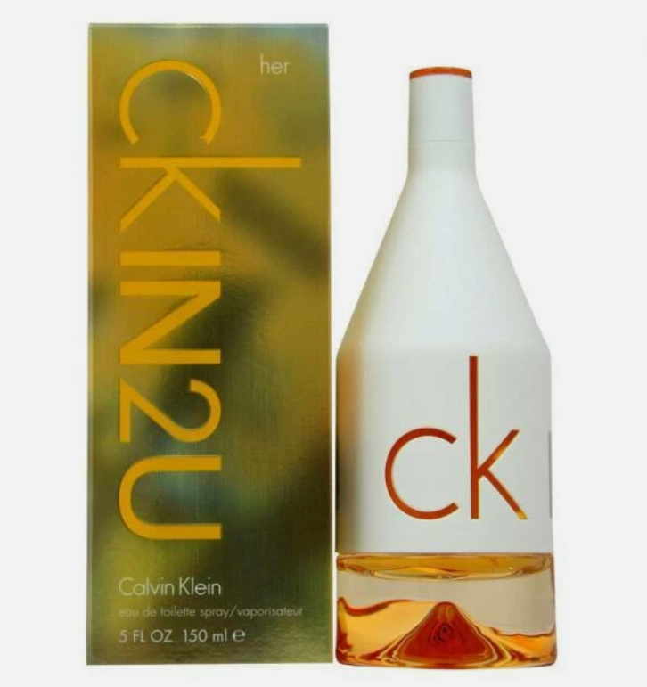 Calvin Klein Her CKIN2U Eau de Toilette bottle and packaging box. The bottle is white with a clear cap and a visible orange-red CK logo, with amber liquid in the lower half.