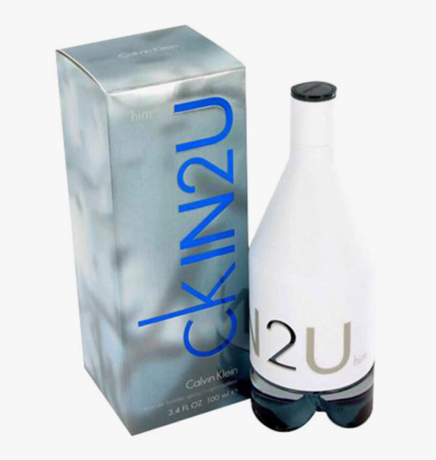 Calvin Klein Skin2U cologne bottle and packaging box on a white background. The bottle is white with a black cap and blue-gray gradient base, next to a metallic silver box with blue 'skin2U' lettering.