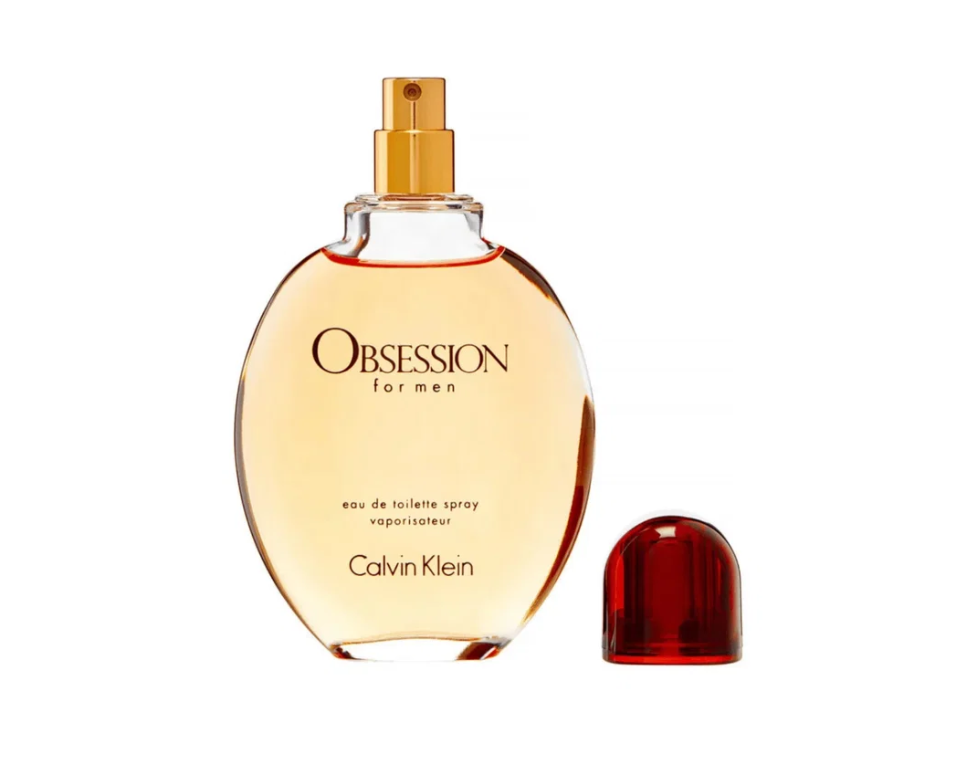 Calvin Klein Obsession for Men Eau de Toilette spray bottle with a gold atomizer and a separate translucent red cap, shown on a plain white background.