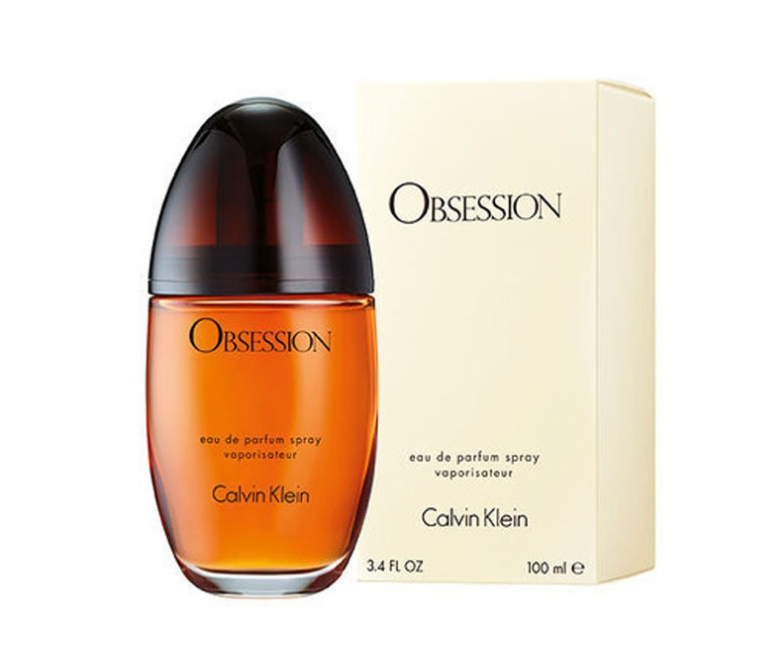Calvin Klein Obsession Eau de Parfum spray bottle with amber liquid and a dark cap, shown next to its cream-colored packaging box on a white background.