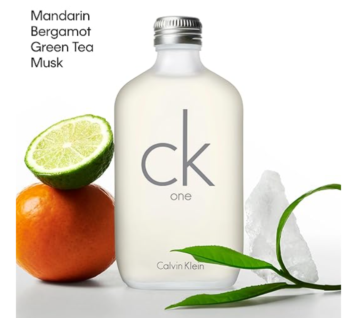 A bottle of Calvin Klein CK One water with a frosted glass body, silver cap, and printed gray 'ck one' logo, shown on a white background with Mandarin orange, lime, green tea leaves, and ice crystals. Text at top left reads 'Mandarin Bergamot Green Tea Musk'.