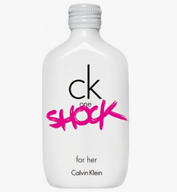A white Calvin Klein CK One Shock bottle for her, featuring a black 'ck' logo and a vibrant pink 'shock' script on the front, set against a plain white background.