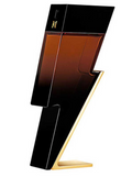 A modern, sculptural perfume bottle with a black and amber-brown gradient body and a gold base, shown on a plain white background.