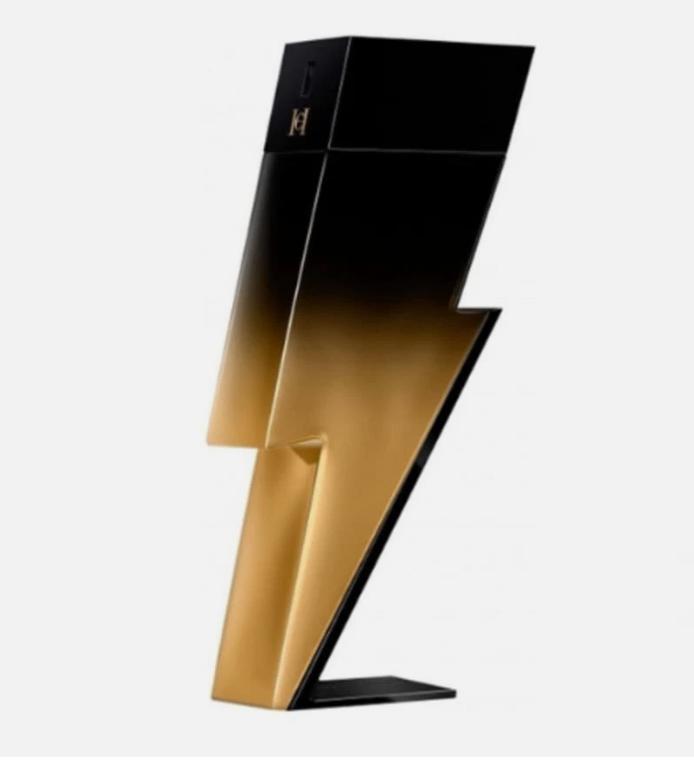 A lightning-bolt-shaped perfume bottle with a glossy black-to-gold gradient finish, standing on a small black base against a plain light background.