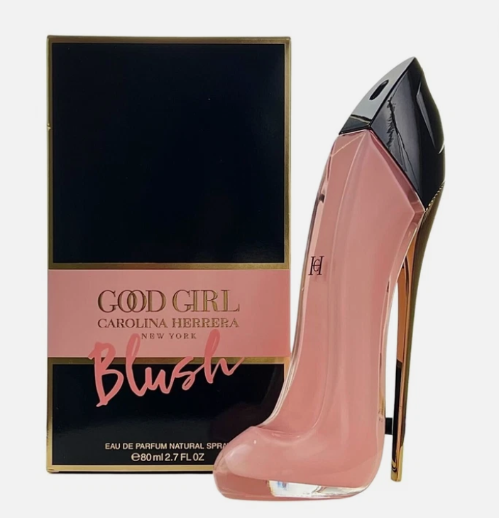 Carolina Herrera Good Girl Blush Eau de Parfum bottle designed like a high-heeled shoe in pink and black, shown next to its black and pink packaging box on a white background.