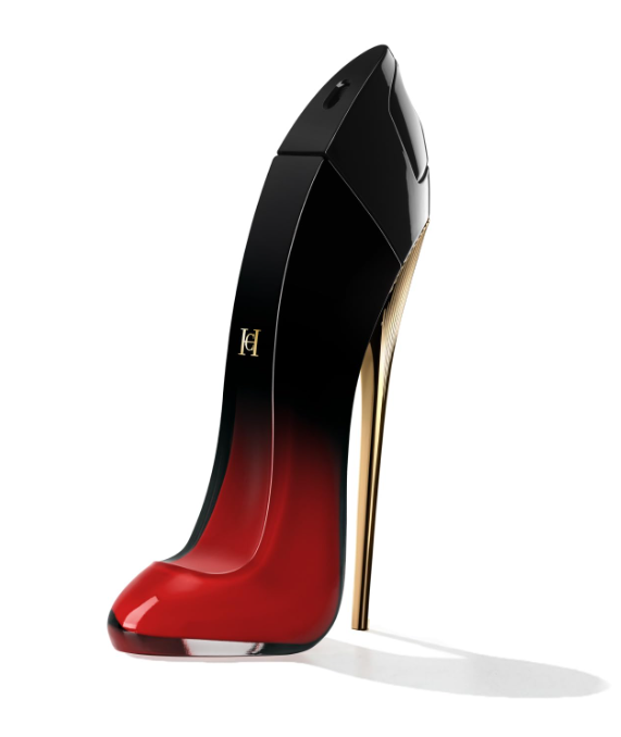 A high-heeled perfume bottle designed like a stiletto shoe, featuring a glossy black upper that fades into a vibrant red at the toe, with a metallic gold heel and a small gold logo on the side, set against a plain white background.