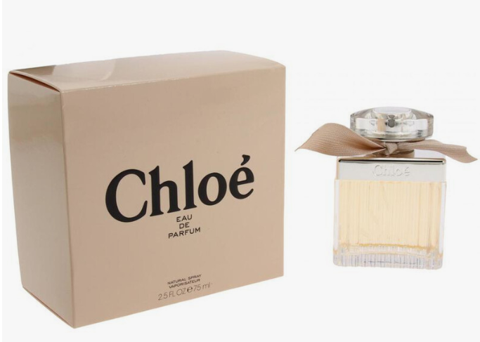 Chloé Eau de Parfum bottle with a beige ribbon bow next to its beige packaging box, on a white background.