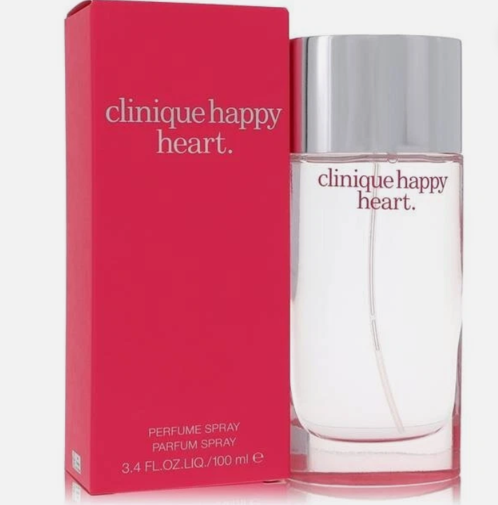 Clinique Happy Heart Perfume Spray bottle next to its bright pink packaging box, on a clean white background.