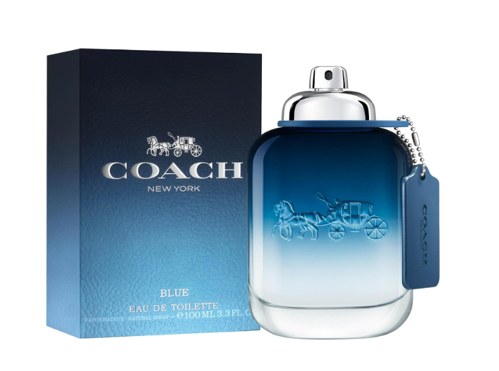 Coach New York Blue Eau de Toilette bottle with a silver cap and a matching blue hangtag, shown next to its dark blue textured packaging box on a white background.