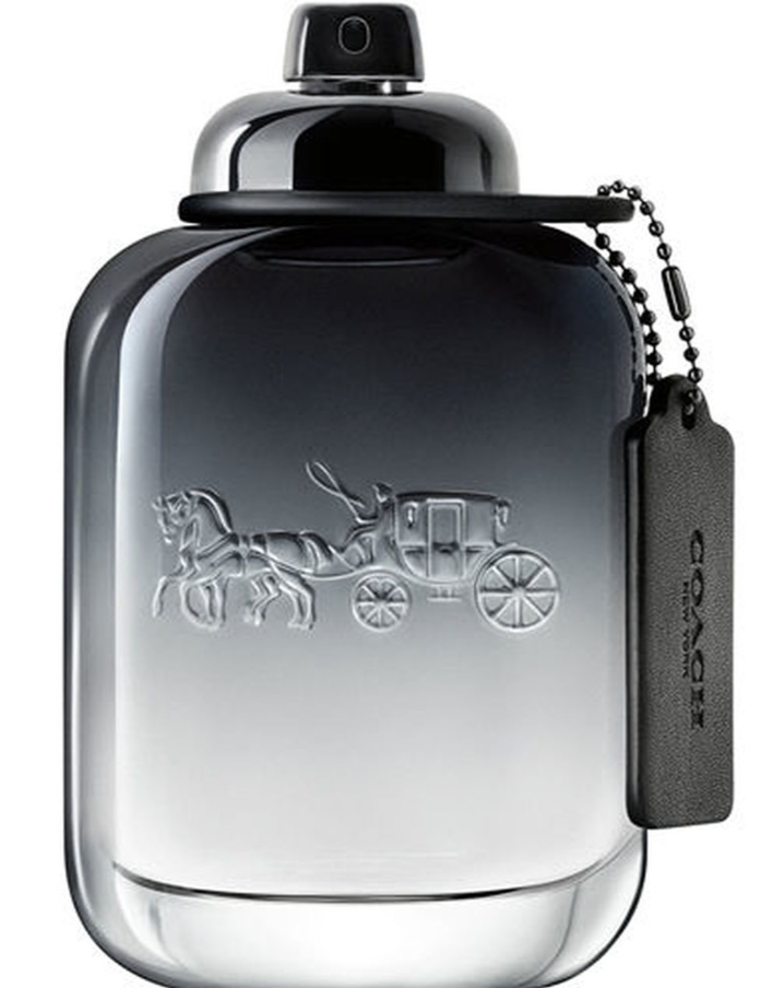 Coach Carriage Eau de Toilette bottle in a smoky black-to-clear gradient glass, featuring an embossed horse-drawn carriage logo and a black branded hangtag on a white background.