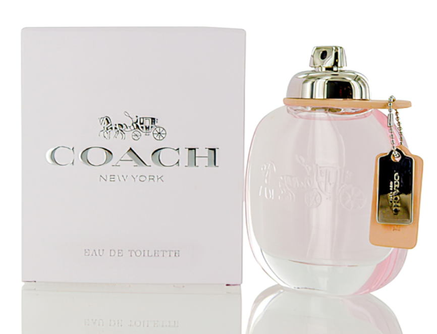 Coach New York Eau de Toilette perfume bottle with a pink tint and gold cap, shown next to its white packaging box with the Coach New York logo.