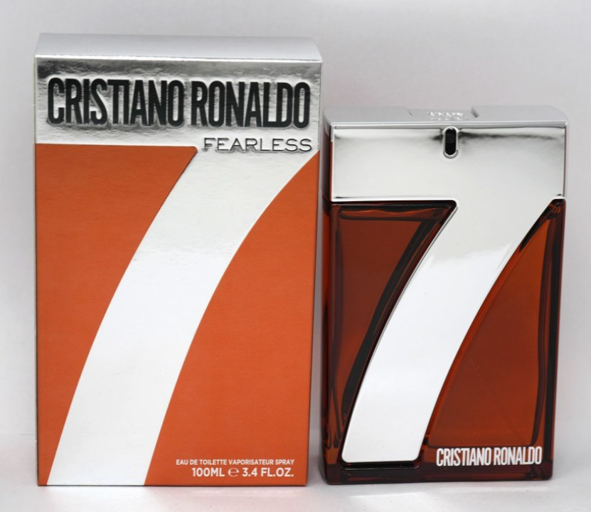 Cristiano Ronaldo Fearless 7 Eau de Toilette spray bottle and its retail box, featuring a bold orange, white, and silver color scheme.