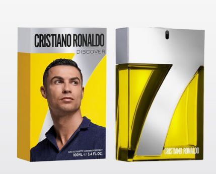 Cristiano Ronaldo Discover Eau de Toilette set showing the retail box and the perfume bottle. The packaging features a portrait of Cristiano Ronaldo on a yellow and gray background, while the bottle has a large metallic silver '7' design with yellow liquid inside.