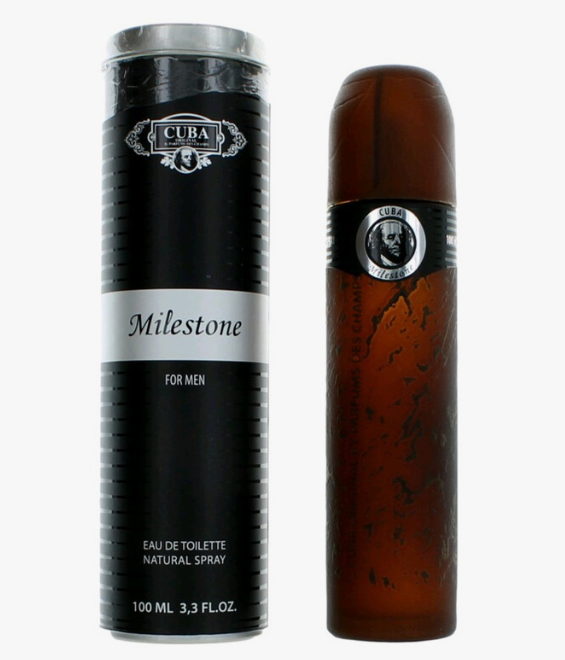 Cuba Milestone fragrance shown as a tall black cylindrical box with a silver band and a matching amber-brown cylindrical bottle with a silver label, on a plain light background.