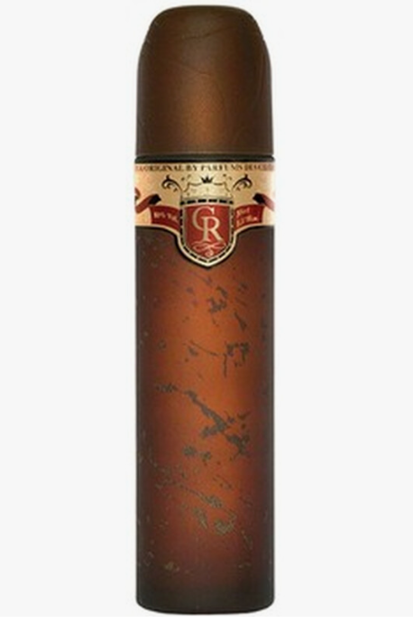 A cylindrical deodorant or body spray bottle designed to look like a cigar, featuring a dark brown textured body, a brown cap, and a decorative label with a red and gold crest and the letter 'R'.