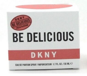 A white rectangular box of DKNY 'Be Delicious' Eau de Parfum Spray, featuring black text and red accents on a white background.