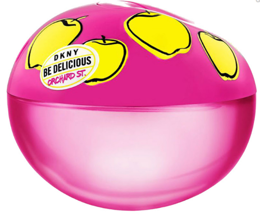 DKNY Be Delicious Orchard St. perfume bottle in a vibrant pink translucent dome shape with yellow apple illustrations on the lid.