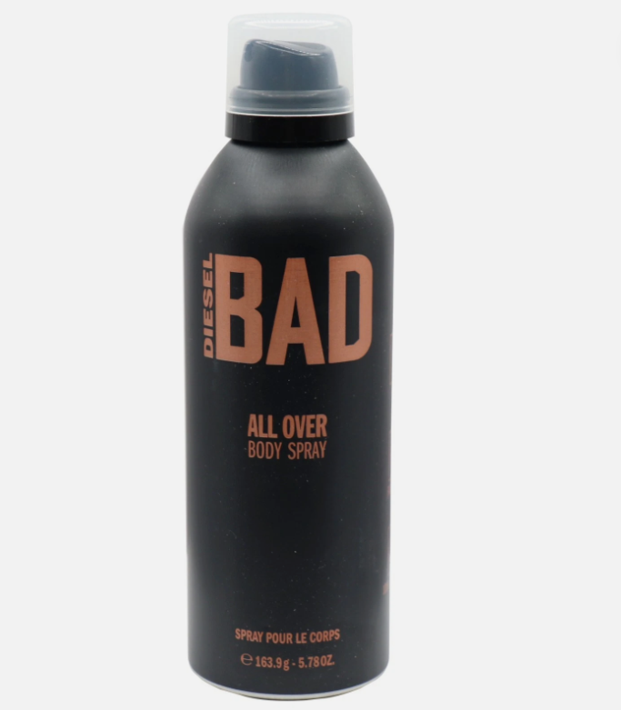 A can of Diesel Bad All Over Body Spray, featuring a matte black aerosol can with a clear cap and bold copper-orange lettering, set against a plain light gray background.