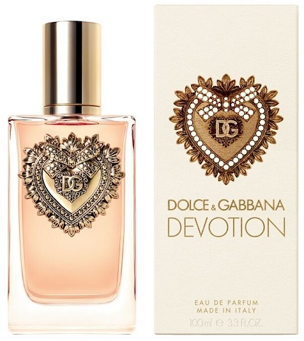 Dolce & Gabbana Devotion Eau de Parfum bottle with a gold cap and ornate heart emblem, shown next to its cream-colored packaging box.