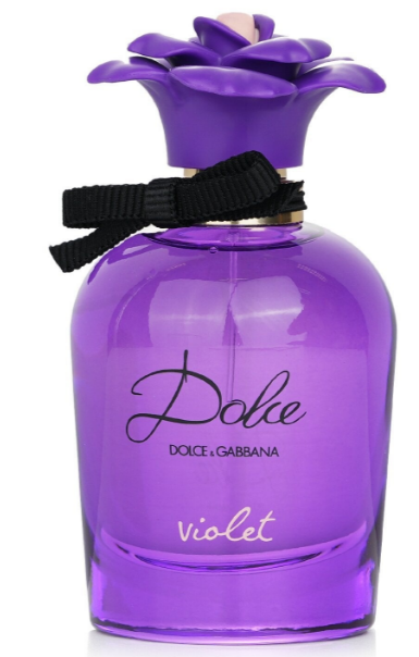 Dolce di Gabbana Violet Eau de Parfum bottle in vibrant purple glass with a matching purple flower-shaped cap, a black ribbon bow, and gold lettering on a white background.