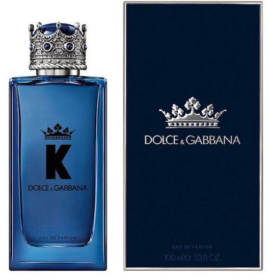 Dolce & Gabbana K EDP perfume bottle in blue glass with a silver crown cap, shown next to its dark blue packaging box featuring a silver crown logo.