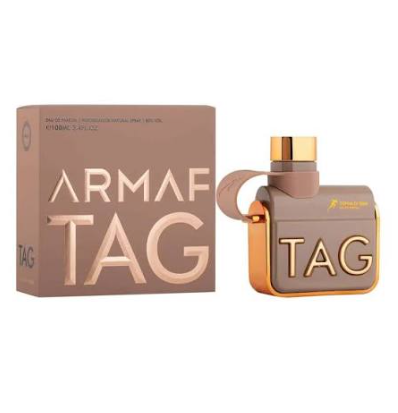 Armaf Tag perfume bottle and its matching packaging box, featuring a metallic taupe-brown design with gold lettering and a gold cap, set against a plain white background.