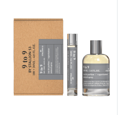 A perfume set from BY STALLION 53, featuring a brown kraft paper box with gray labels, a slim silver atomizer vial, and a larger clear glass spray bottle filled with pale yellow liquid.