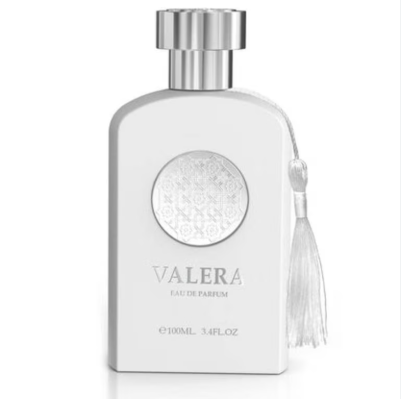 A white rectangular perfume bottle with a silver cap and a white tassel, labeled VALERA EAU DE PARFUM.