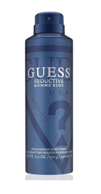 Guess Seductive Homme Blue deodorizing body spray in a 6.0 oz aerosol can, featuring a dark blue design with white and silver text.