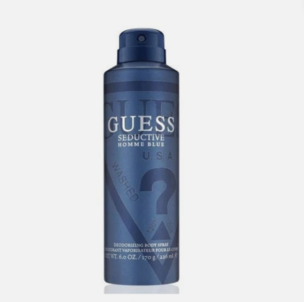 A single aerosol can of Guess Seductive Homme Blue deodorizing body spray on a light gray background.