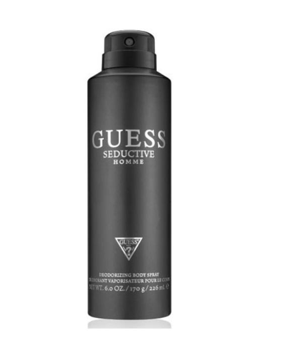 A black aerosol can of GUESS Seductive Homme deodorizing body spray on a plain white background.