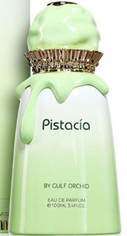 A bottle of Pistacia Eau de Parfum by Gulf Orchid, featuring a white bottle with a light green cap and dripping green detailing, and a gold pleated collar.