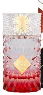 A faceted crystal vase with a red and pink gradient base, featuring a gold diamond-shaped label that reads 'Sweet Heaven' and 'Tiffany'.