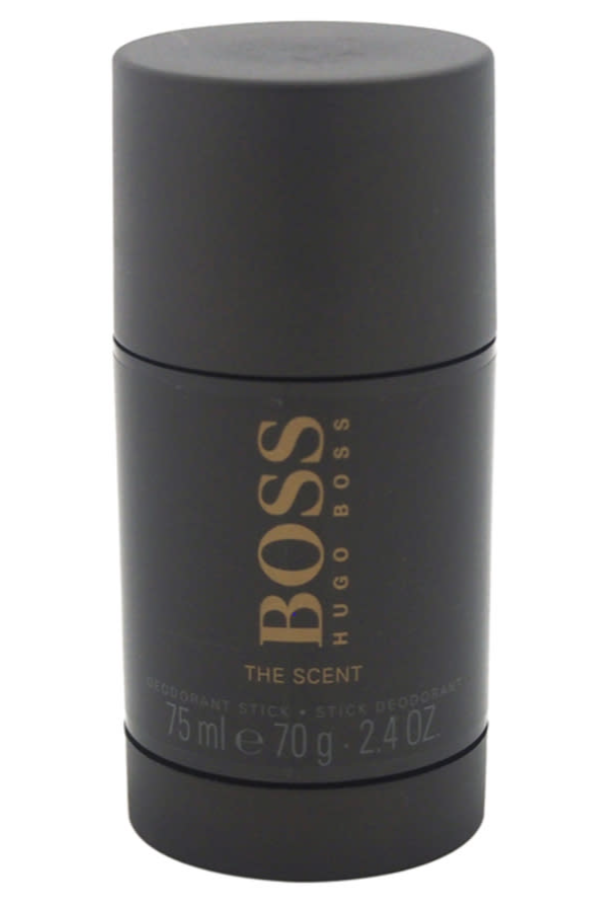 Hugo Boss The Scent deodorant stick in a matte black cylindrical container with gold lettering, shown against a plain white background.
